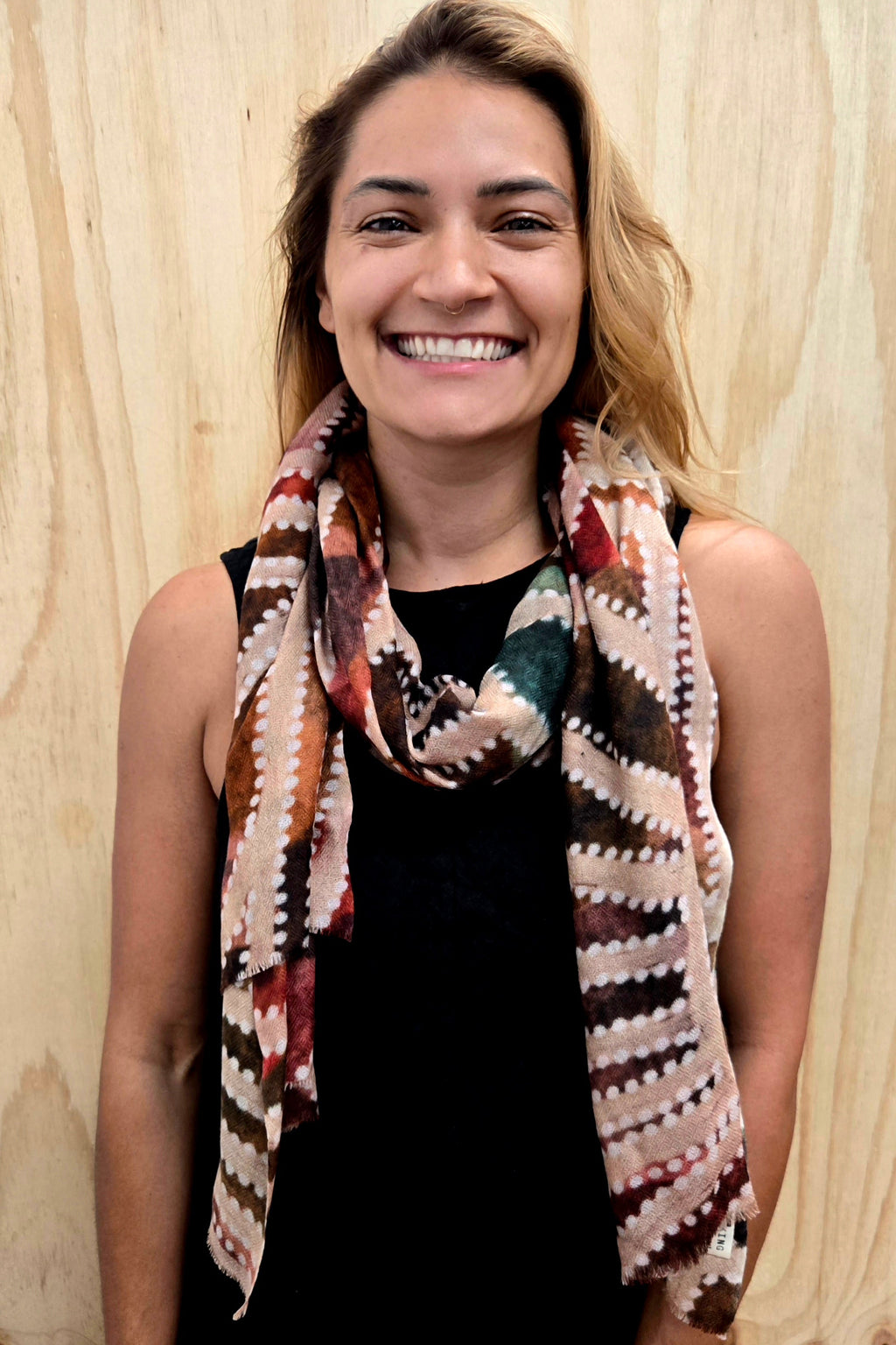 An Aboriginal woman wearing a Aboriginal artwork scarf in cashmere wool